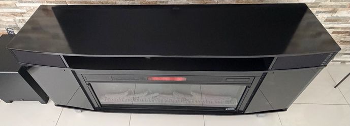 Beautiful electric fireplace with fire effects and blue tooth speakers, remote. Price to move fast so don’t wait. $250