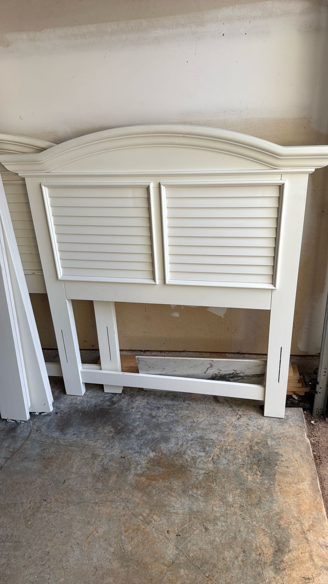 Two cream twin bed with rails and slats