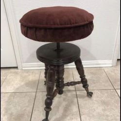 ANTIQUE PIANO CHAIR SWIVELS IN GREAT CONDITION COMES W CUSHION 