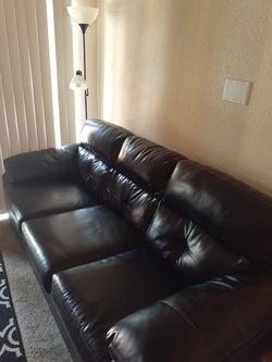 Queen size bed and leather couch