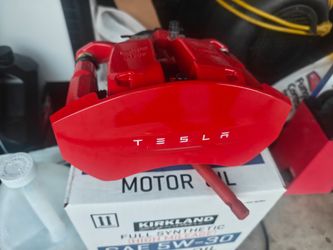 Model 3 red rear right caliper