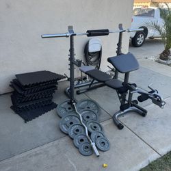 Bench press/squat rack with 7ft bar plus 240lbs weights plus curl bar and mats firm price