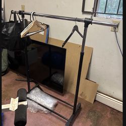 LOW PRICE MOVING- CLOTHING RACK COLLAPSABLE AND EXPANDABLE