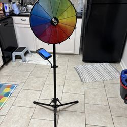 Two Spinning Game Wheels $54 For Large W/stand, $28 For Small.