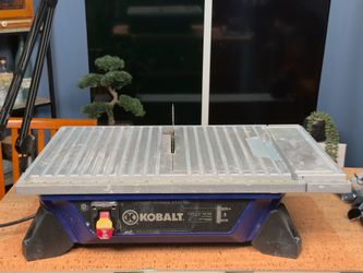 Kobalt 7-inch Tile Saw with four additional blades and guide.