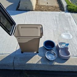 DOG/CAT FOOD  ROLLING STORAGE BIN, WATER,FOOD DISH, SELF WATERING WATER DISH. ALL 1-PRICE..asking $30.00