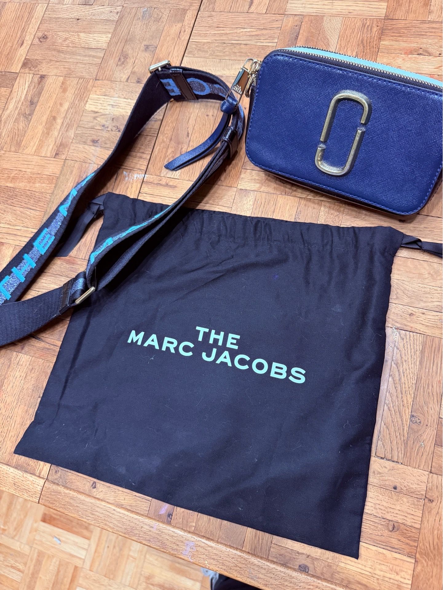 The Marc Jacobs Snapshot Blue Saffiano Leather Camera Crossbody Bag with Logo Strap