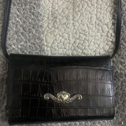 Brighton black crocodile-embossed leather convertible bag.