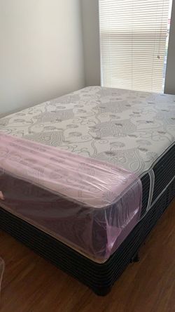 New queen mattress and box spring. 2 pc bed frame is not included