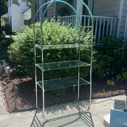 Silver display stand with four glass shelves
