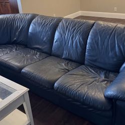 Large curved Leather sofa. Price Including Delivery 