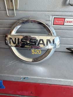 Chrome Nissan Emblem Badge