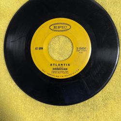 This item is a collectible vintage 1968 7-inch 45 RPM vinyl record by Donovan, featuring the song "Atlantis" on one side and "To Susan on the West Coa