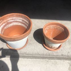 Two Flower Pots With Plates