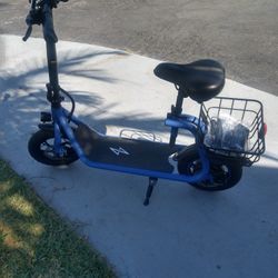 Electric Scooter With Basket To Carry Things