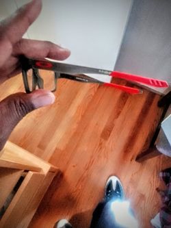 Oakley reading glasses the color is red arms and grey frames