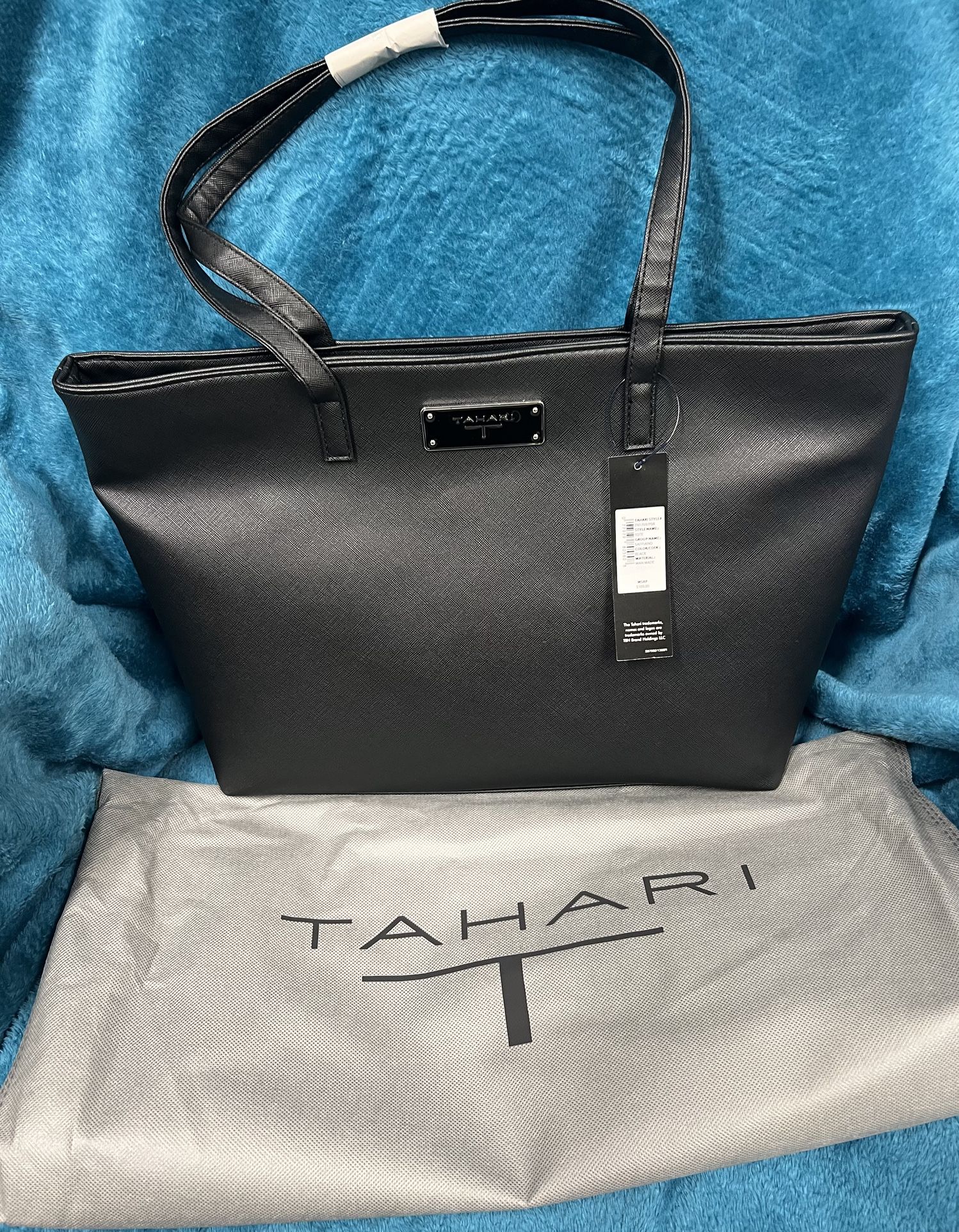 BRAND NEW IN BAG TAHARI Tote Black Saffiano Man Made Leather Style #TN1769/P08 NWT In Packaging This TAHARI Tote is a stylish addition to any wardrobe