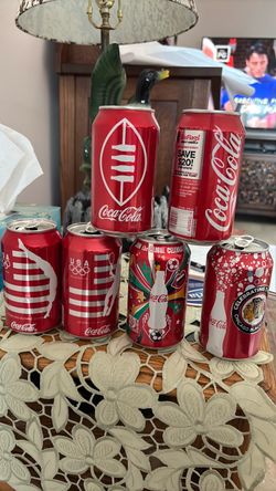 Six Coca Cola 12 oz. Cans featuring sports