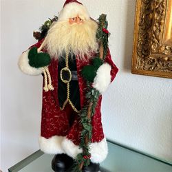 Vintage standing Santa wearing a long velvet and gold coat stands 21 inches