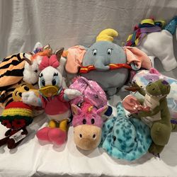 Lot of stuffed animals Disney dinosaur cat Dumbo unicorn 