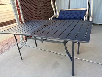 Big metal table with umbrella holder