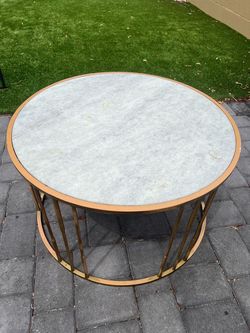 White and gold marble round table