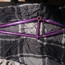 This is a BMX bike frame, specifically an S&M Dagger frame in a "Sour Grape" purple color.