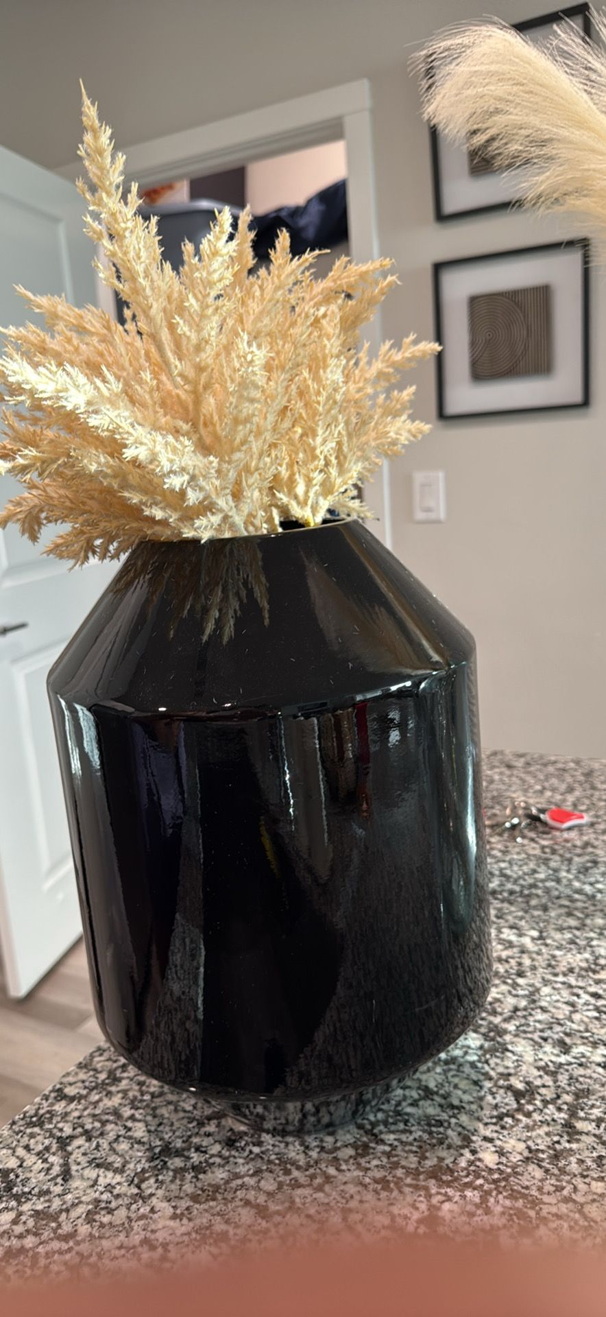Black vase with gold stripe
