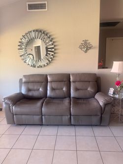 Grey leather reclining couches