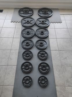255 Ib Sport authority Olympic weight plate with weight tree