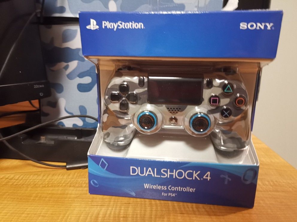 PS4 2TB with a controller, a monitor, and a headphone