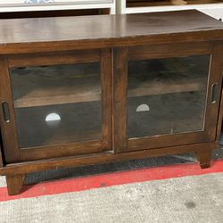 TV stand 4 foot with two Sliding Glass Doors  shelves inside 