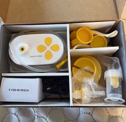 Medela pump with extra parts