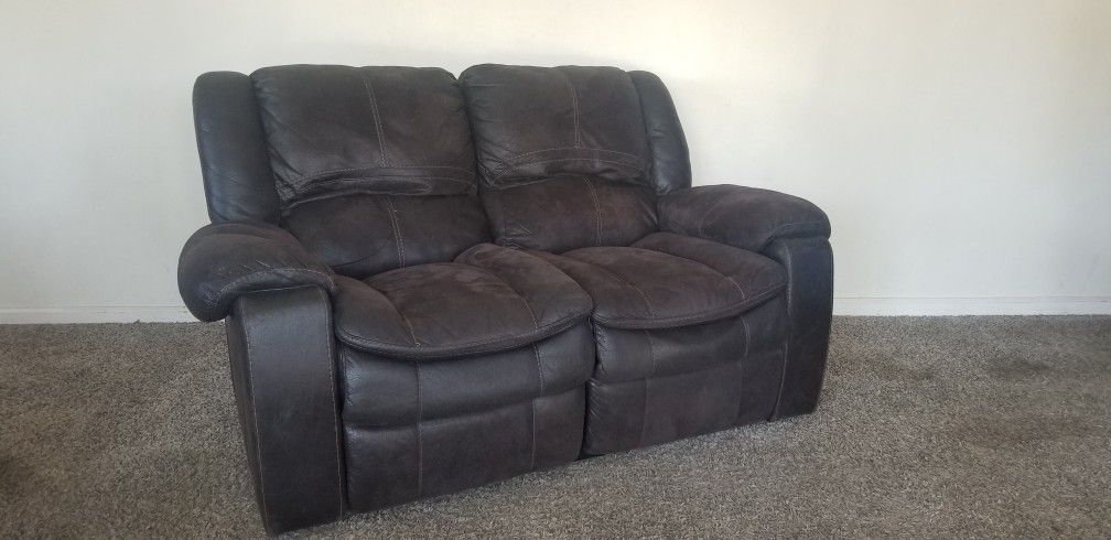 Is brown leather couch