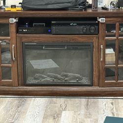 Entertainment center with faux fireplace, and heater
