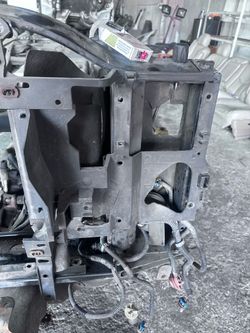 Yukon headlight driver side  plastic frame