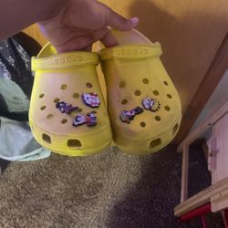 Yellow crocs shop with charms