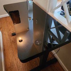 Tempered Glass/Metal Electric Standing Desk w/ Built-In Charging Pad, Drawer, and 2 USB ports.