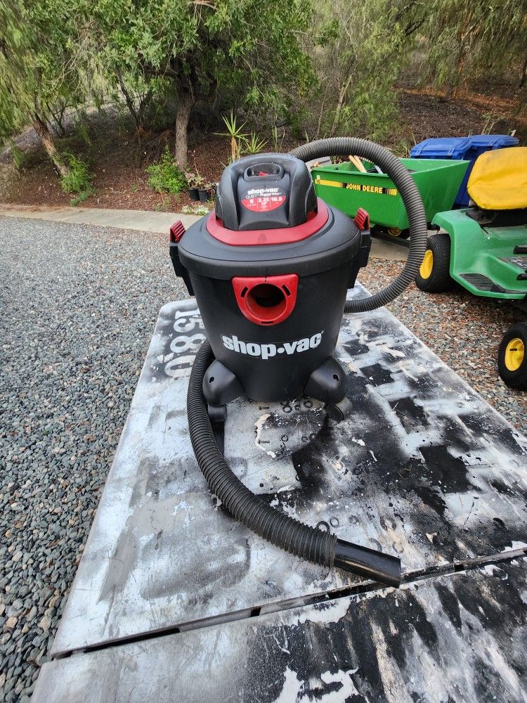 Shop vacuum 5 gal with wheels works great ready for a new home.