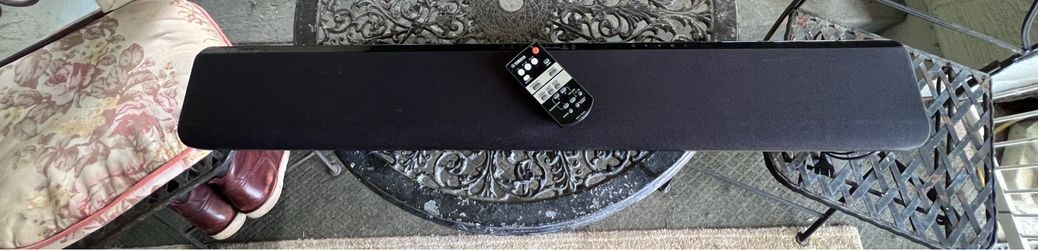 Yamaha sound bar with remote.