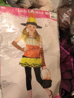Costume candy corn witch everything included. Dress with tulle skirt footless tights. Sleeveless. Hat