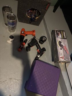 Sander, drill with charger, tail pipe tips, speaker box, small step stool and camera