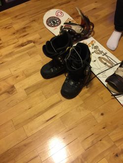 Tabla de esquiar con sus botas size 10