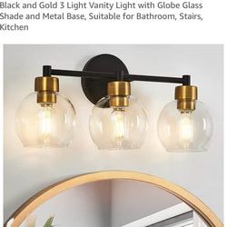 Black and Gold 3 Light Vanity Light with Globe Glass Shade and Metal Base