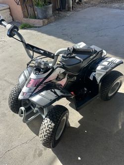 Razor Dirt Quad – 24V Electric 4-Wheeler Ride-On for Kids 8+, T wist-Grip Variable-Speed Acceleration Control, Up to 8 MPH, Forward/Reverse Drive Mode