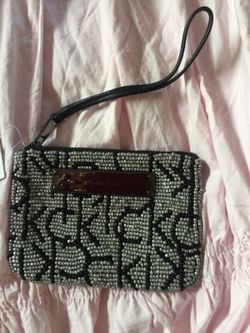 Brand new Calvin Klein beaded wristlet