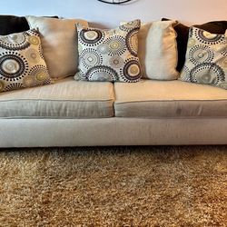 Beige Sofa with Patterned Cushions