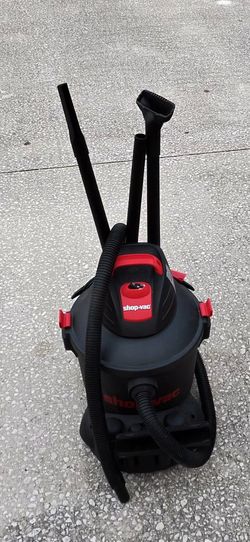 This is a Shop-Vac wet/dry utility vacuum featuring a black tank and red accents.