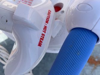 Clothing and upholstery steamer