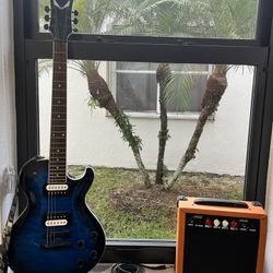 Dean Thoroughbred X Quilt Maple Electric Guitar Transparent Blue Burst, Orange Lyx Pro Amplifier,7 Professional Playing Picks, Two Guitar Wall Holders